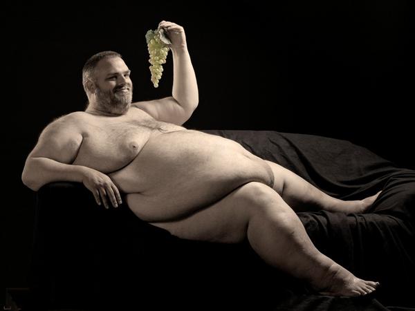 fat man eating grapes. Fatass Eating Healthy